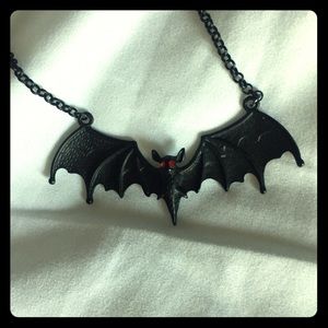 Bat necklace with red jewel eyes